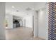 Open-concept living space featuring kitchen with gray cabinets and neutral decor at 4801 E Horseshoe Rd, Paradise Valley, AZ 85253
