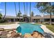 Beautiful backyard oasis with a freeform pool, lush landscaping, and a covered patio at 4801 E Horseshoe Rd, Paradise Valley, AZ 85253