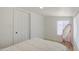 Bright bedroom with natural light, wood floors, and a closet for ample storage at 520 S Macdonald --, Mesa, AZ 85210