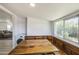 Breakfast nook with wooden table, built-in booth seating, and large windows for natural light at 520 S Macdonald --, Mesa, AZ 85210