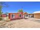 Charming single-story home featuring a well-manicured yard and a welcoming entrance at 520 S Macdonald --, Mesa, AZ 85210
