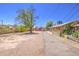 Cozy single-story home with a spacious yard and a private driveway leading to the property at 520 S Macdonald --, Mesa, AZ 85210