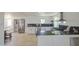 Spacious kitchen with stainless steel appliances, white cabinets, and a breakfast nook at 520 S Macdonald --, Mesa, AZ 85210