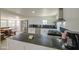 Kitchen featuring white cabinets, stainless steel appliances, and a dark countertop island at 520 S Macdonald --, Mesa, AZ 85210