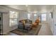 Cozy living room features a comfortable sofa, bright windows, stylish rug, and neutral paint at 520 S Macdonald --, Mesa, AZ 85210