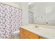 This bathroom showcases a vanity and bright shower curtain at 521 N Cambridge St, Gilbert, AZ 85233