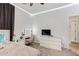 This bedroom boasts a makeup vanity, ceiling fan, and natural light at 521 N Cambridge St, Gilbert, AZ 85233