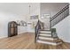 Spacious foyer with wood floors, staircase with iron railings, and stylish decor at 521 N Cambridge St, Gilbert, AZ 85233