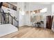 Bright entry featuring wood floors, a staircase with iron railings, and home office nook at 521 N Cambridge St, Gilbert, AZ 85233