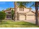 Beautiful two-story home with green lawn and a convenient three-car garage at 521 N Cambridge St, Gilbert, AZ 85233
