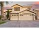 Elegant two-story home featuring a spacious three-car garage and meticulously maintained landscaping at 521 N Cambridge St, Gilbert, AZ 85233