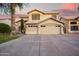 Elegant two-story home featuring a spacious three-car garage and meticulously maintained landscaping at 521 N Cambridge St, Gilbert, AZ 85233