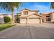 Lovely two-story home boasts a three-car garage and a neatly kept front yard at 521 N Cambridge St, Gilbert, AZ 85233