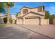 Charming two-story home featuring a three-car garage and desert landscaping at 521 N Cambridge St, Gilbert, AZ 85233