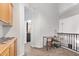 Hallway with cabinets and views to bedroom and banister with railing at 521 N Cambridge St, Gilbert, AZ 85233
