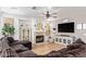 Inviting living room featuring a fireplace, wood floors, and built-in shelving at 521 N Cambridge St, Gilbert, AZ 85233