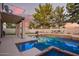 Enjoy a refreshing pool with an attached spa, surrounded by a patio, ideal for relaxation and entertaining at 521 N Cambridge St, Gilbert, AZ 85233