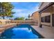 Inviting pool area with a clear blue pool and a patio, ideal for relaxing and enjoying the outdoors at 521 N Cambridge St, Gilbert, AZ 85233