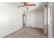 Bright bedroom featuring neutral walls, carpet, and a closet with sliding doors at 619 E Jensen St # 34, Mesa, AZ 85203