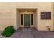 A home's entryway featuring a security door and decorative shrubbery at 619 E Jensen St # 34, Mesa, AZ 85203