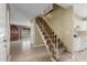Inviting entryway featuring tile flooring, a staircase, and access to the kitchen at 619 E Jensen St # 34, Mesa, AZ 85203
