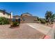 Charming home with a well-maintained front yard and a two-car garage at 619 E Jensen St # 34, Mesa, AZ 85203