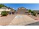 Charming home with a well-maintained front yard and a two-car garage at 619 E Jensen St # 34, Mesa, AZ 85203