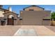 Two-car garage in a charming home with an arched side entrance at 619 E Jensen St # 34, Mesa, AZ 85203