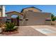 Charming two-story home with a spacious two-car garage and adjacent landscaping at 619 E Jensen St # 34, Mesa, AZ 85203