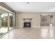 Living area features a fireplace with tile surround and sliding glass door access to the yard at 619 E Jensen St # 34, Mesa, AZ 85203