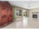 Living area boasts tile flooring, fireplace, and sliding glass doors for outdoor access at 619 E Jensen St # 34, Mesa, AZ 85203