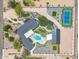 An aerial view showcasing the estate's lush landscaping, pool, pickleball court, garages, and unique layout at 6310 E Desert Cove Ave, Scottsdale, AZ 85254