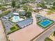 Expansive property featuring a large home, pool, tennis court, and a spacious driveway at 6310 E Desert Cove Ave, Scottsdale, AZ 85254