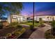 Charming backyard featuring lush landscaping, string lights, and inviting pathways for outdoor enjoyment at 6310 E Desert Cove Ave, Scottsdale, AZ 85254