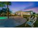 Outdoor lounge area with comfortable seating and covered patio, by the pool at 6310 E Desert Cove Ave, Scottsdale, AZ 85254