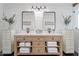 Farmhouse bathroom with a double vanity, white shiplap walls, and black accents at 6310 E Desert Cove Ave, Scottsdale, AZ 85254