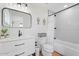 Stylish bathroom features white vanity, black fixtures, and modern tiled shower at 6310 E Desert Cove Ave, Scottsdale, AZ 85254