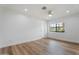 Clean, bright bedroom features hardwood floors and a large window at 6310 E Desert Cove Ave, Scottsdale, AZ 85254