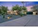 Single-story home featuring desert landscaping, long driveway and a 3 car garage at 6310 E Desert Cove Ave, Scottsdale, AZ 85254