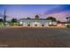 Spacious four-car garage offering ample parking and storage, complemented by a well-kept gravel driveway at 6310 E Desert Cove Ave, Scottsdale, AZ 85254