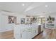 A bright kitchen features a large island, stainless steel appliances, and an open layout at 6310 E Desert Cove Ave, Scottsdale, AZ 85254