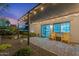 Relaxing outdoor patio featuring comfortable seating, stylish lighting, and views of the beautifully landscaped yard at 6310 E Desert Cove Ave, Scottsdale, AZ 85254