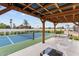 Covered outdoor pickleball court with an adjacent seating area, perfect for enjoying recreational activities at 6310 E Desert Cove Ave, Scottsdale, AZ 85254