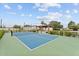 A vibrant outdoor pickleball court with a covered seating area, offering an ideal space for recreation and relaxation at 6310 E Desert Cove Ave, Scottsdale, AZ 85254