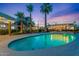 Backyard pool with palm trees and relaxing outdoor entertaining area at 6310 E Desert Cove Ave, Scottsdale, AZ 85254