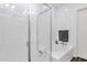 Clean bathroom showcasing a glass-enclosed shower and soaking tub, with sleek fixtures and white tile at 6565 E Thomas Rd # 1096, Scottsdale, AZ 85251