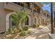 Attractive building facade showcasing architectural details and lush landscaping at 6565 E Thomas Rd # 1096, Scottsdale, AZ 85251