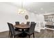 Cozy dining area with a round table and seating for six, bathed in natural light at 6565 E Thomas Rd # 1096, Scottsdale, AZ 85251