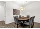 Elegant dining room with seating for six and a stylish light fixture creating a perfect ambiance at 6565 E Thomas Rd # 1096, Scottsdale, AZ 85251