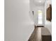 Bright entryway featuring wood-look flooring, a cozy bench, and modern wall decor at 6565 E Thomas Rd # 1096, Scottsdale, AZ 85251
